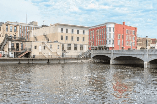 How to Get ChoiceCash Title Loans in Janesville, WI The townscape of Janesville, Wisconsin with colorful buildings along the river